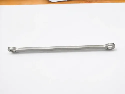 Finished turbocharger vent valve connecting plate stamped from 304L stainless steel with clean, burr-free edges